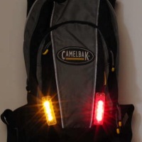 Integrated backpack bike flashers