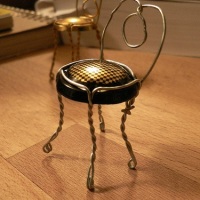 Make a little chair out of a champagne cork holder