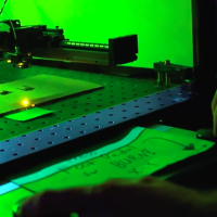 Free Form Laser Cutting a la Etch a Sketch: Laser Craze