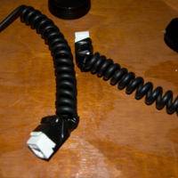 Extend your camera’s flash cord with a CAT5 network cable