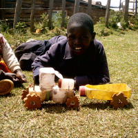 Toy tractor and trailer built from trash