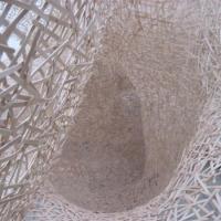 Giant cobweb made of coffee stirrers