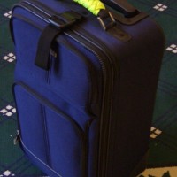 High-visibility paracord luggage handle wrap