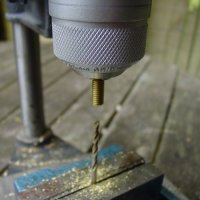 Use your drill press in reverse to make perfectly centered holes