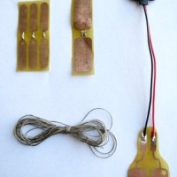 Sew-through PCBs for soft circuit designers