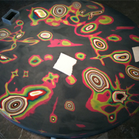 Color-layered table decorated by sanding