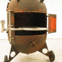 Charcoal grill made from recycled naval mine casings