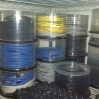 Reusing old optical disc spindles for cable storage