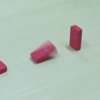 Wireless dominoes topple without touching
