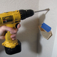 Tape Up a Coffee Filter to Catch Drill Dust