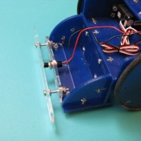 Make: Projects – Tiny Wanderer Bump Sensor and “Moth” Behavior
