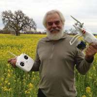 Quadcopter Flying Over a Field of Yellow Mustard
