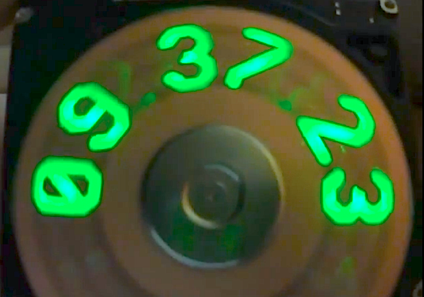 A Spinning POV Hard Drive Platter Clock