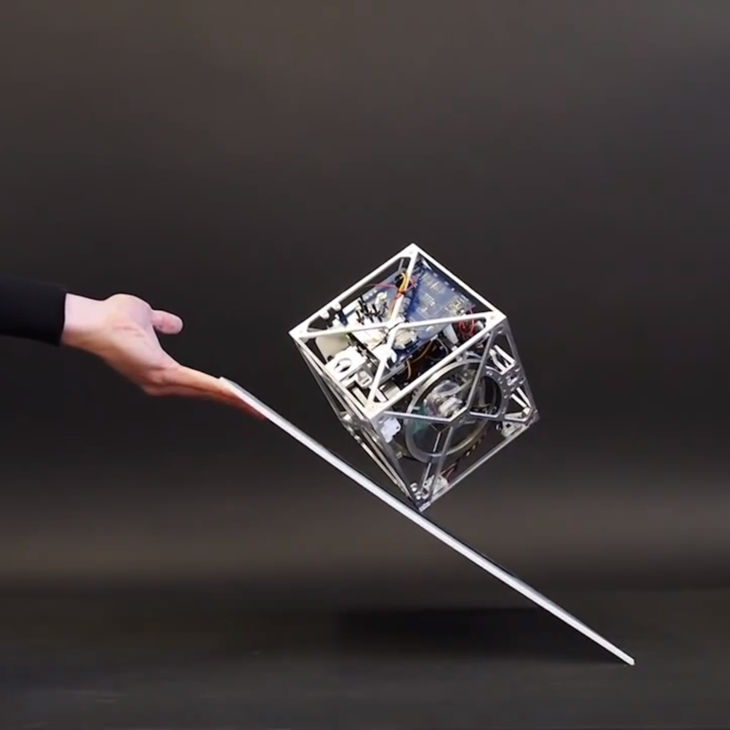 Cubli: The Cube That Can Walk and Jump