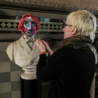 Manchester Town Hall Yarn Bombed With Crocheted Masks