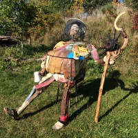 Beekeeper Sculpture Contains an Actual Bee Hive