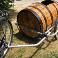 Stylishly Port a Passenger with this Wine Barrel Bike Trailer