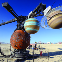 Watch the Fiery Rotations of a 40-Foot-Wide Mechanical Solar System