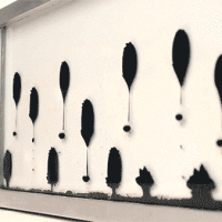 Ferrofluid Clock Moves Like Elegant Little Caterpillars