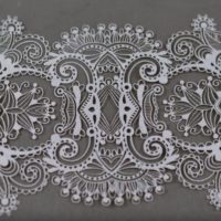 Watch Lasers Cut Intricate Lace Designs From Paper