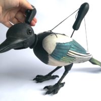 This Delightful Magpie Puppet is Carved from Wood