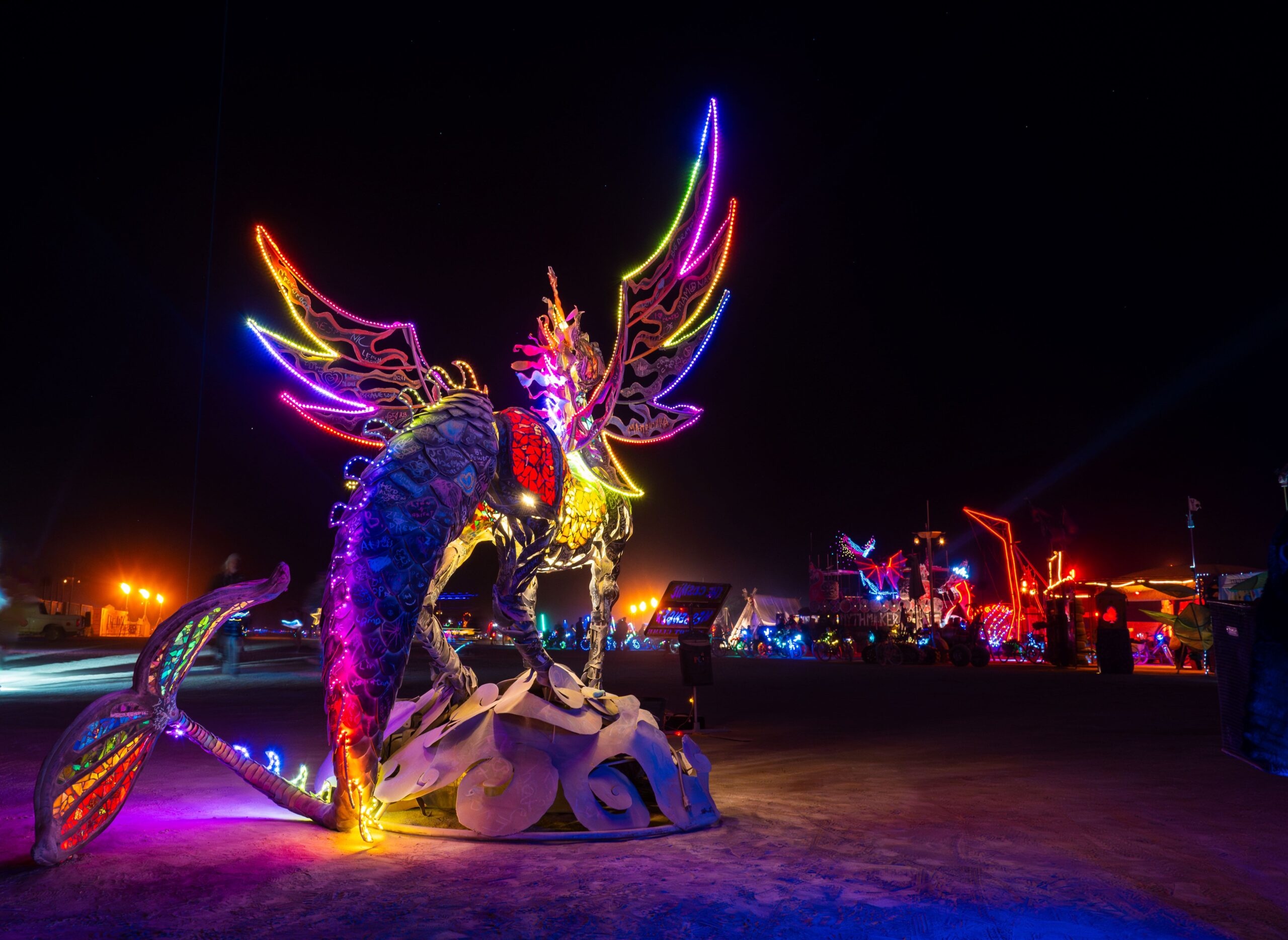 Metal and glass Pegasus unicorn at night